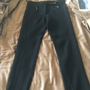 Pants with seaming and side zippers at ankle